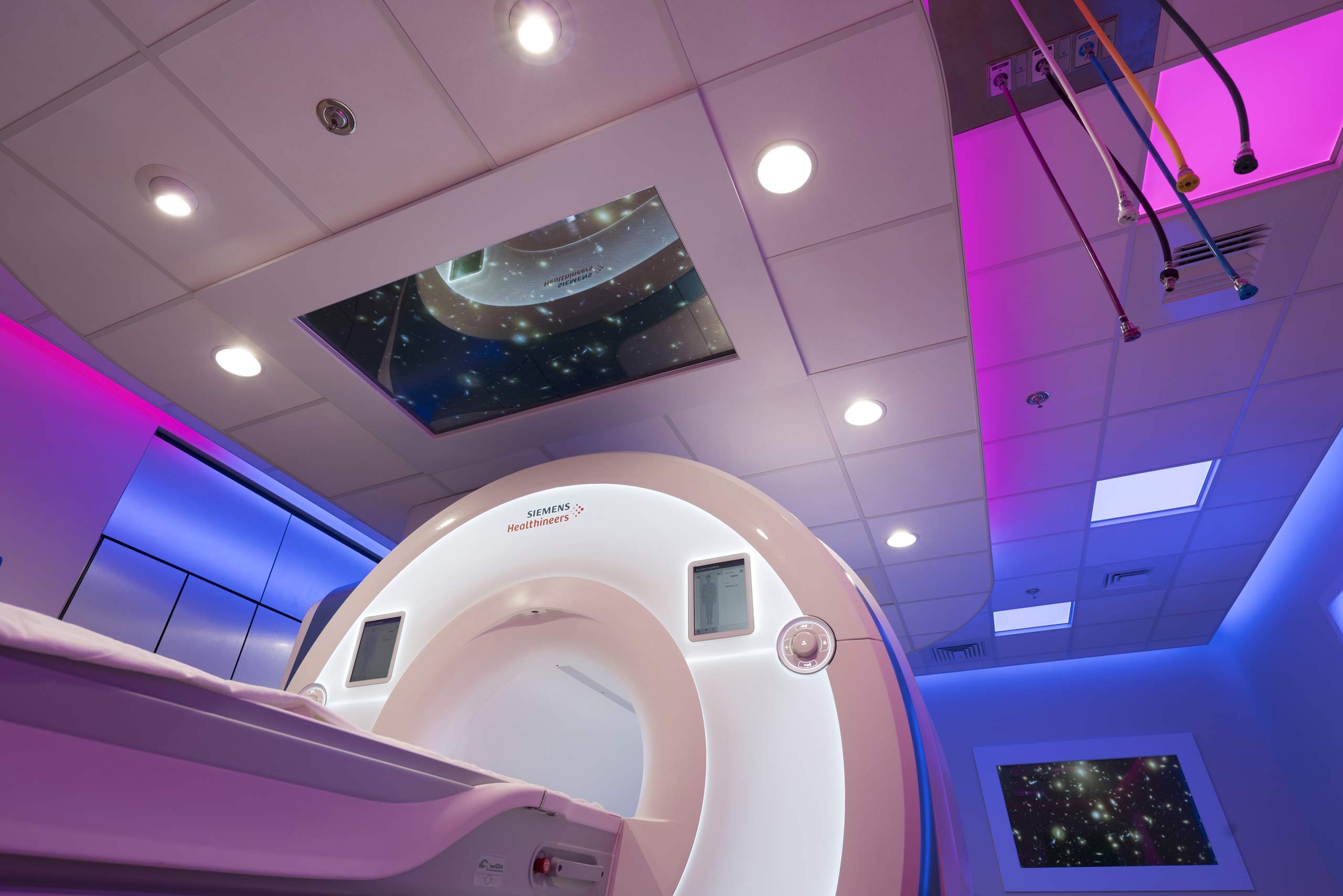 PeaceHealth Sacred Heart Caring MR Suite® with 4K Video Display, Hospital and MRI LED Lighting, custom LED Cove Lighting and Directional LED Task Lights. More than MRI patient entertainment