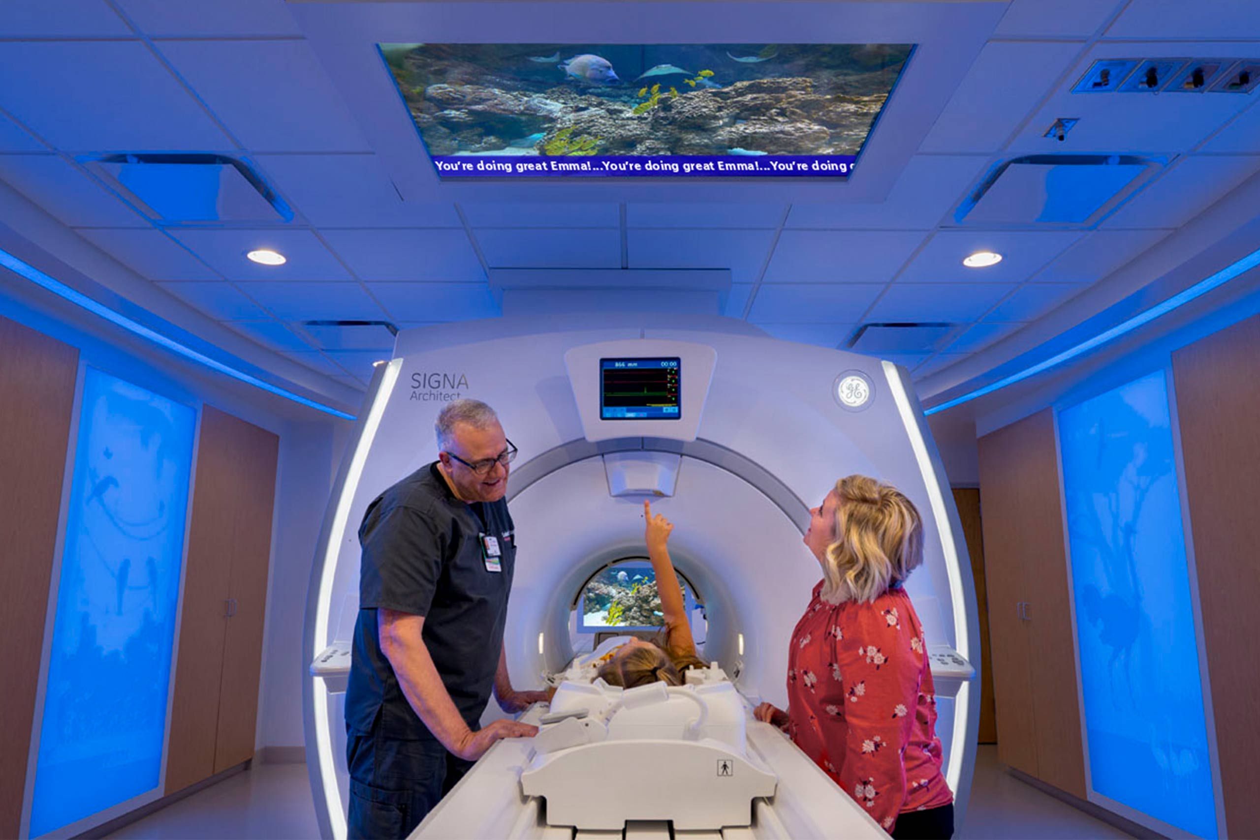 Saint Francis Children's pediatric Caring MR Suite® featuring 4K Ceiling Video Display, MRI in-bore viewing, RGB LED Lighting + custom Illuminate Wall Fixtures